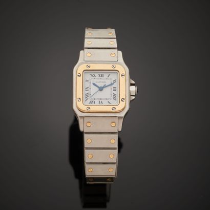 null CARTIER "Santos".
Montre bracelet en acier et or jaune 18k, boîtier carré, cadran...