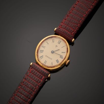 null TISSOT. 
Wristwatch, oval case in 18k yellow gold, cream dial applied with Roman...