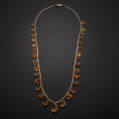 null Drapery necklace composed of a row of fine pearls alternated with thirty oval-cut...