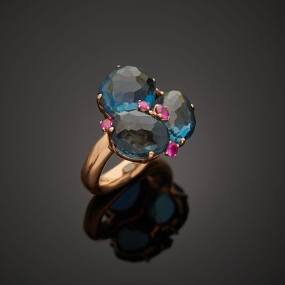 null POMELLATO "Bahia".
18k rose gold ring, featuring three faceted topazes punctuated...