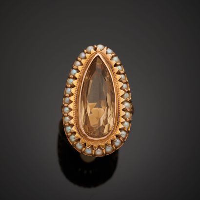 Ring in 14k pink gold set with a pear-cut...