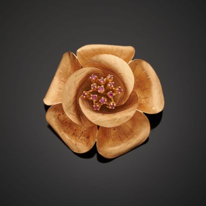 null 18k rose gold brooch featuring a flower with engraved petals and punctuated...