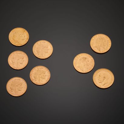 Five gold coins of 20 Francs with the profile...