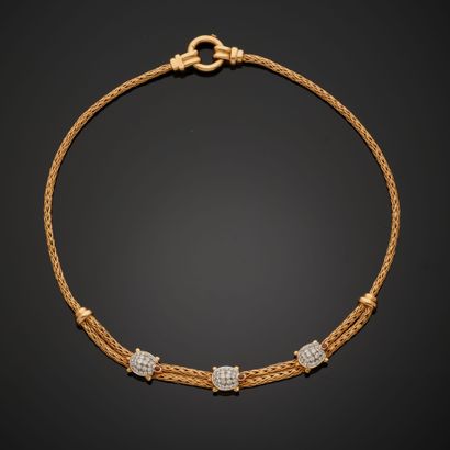 null 18k yellow gold necklace composed of two palm link chains, adorned with three...