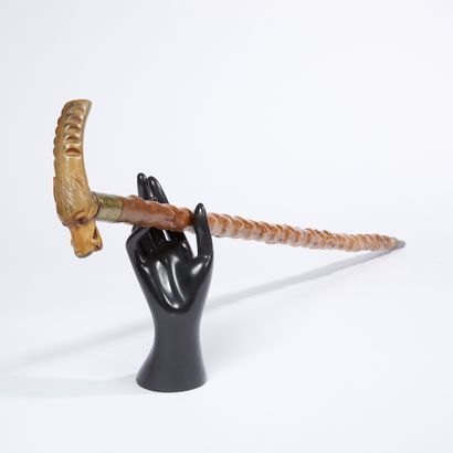 Cane. 
Figurative horn knob carved with a...
