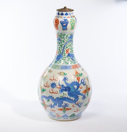 null CHINA.
Porcelain baluster vase with polychrome enamel decoration of dragons...