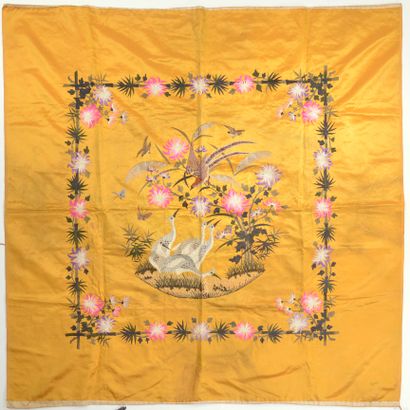 null CHINA. 
Square-shaped orange silk panel embroidered with flowers, cranes and...