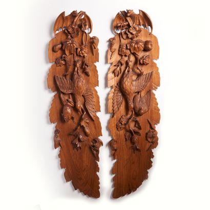 null CHINA.
A pair of carved teak panels decorated with bats, birds and a frog. 
20th...