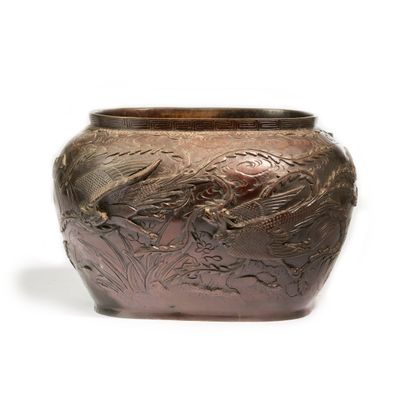 null VIETNAM. 
Oval planter, in reddish-brown patinated metal, richly decorated with...