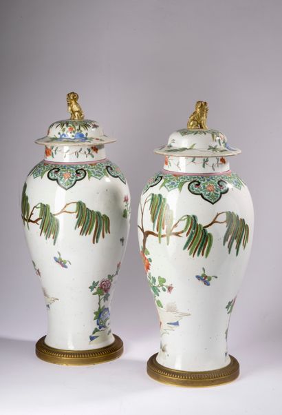 null SAMSON.
Pair of porcelain covered and baluster potiches decorated in polychrome...