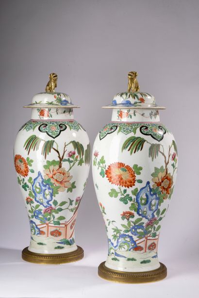 null SAMSON.
Pair of porcelain covered and baluster potiches decorated in polychrome...
