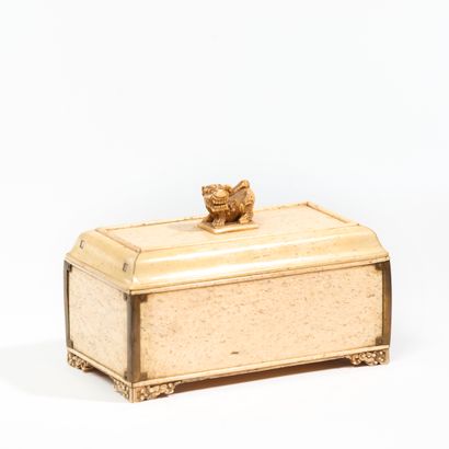 null CHINA.
Rectangular bone box, the frétel decorated with a lion, the corners in...