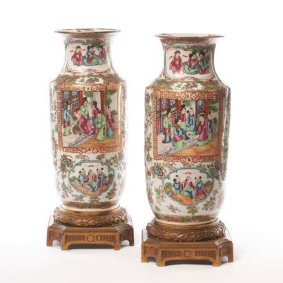 null CHINA.
Pair of flared-neck porcelain scroll vases with polychrome decoration...