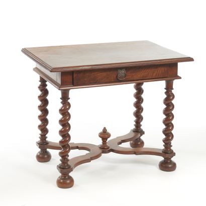 null Molded, turned and carved walnut writing table, with a drawer opening at the...