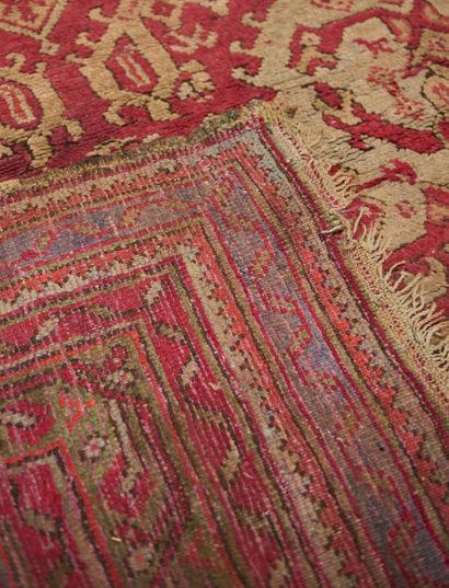 null Smyrna. 
Large wool carpet with stylized motifs on a purplish background, wide...