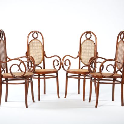 null Salvatore LEONE.

Suite of four high-backed armchairs in curved wood with scrolled...