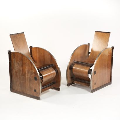 null Modernist work.
Pair of armchairs in walnut and chromed metal, seat in molded...