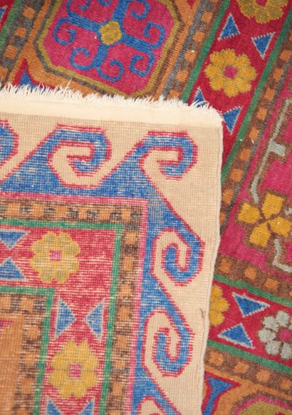 null KAZAK, Caucasus.
Large rectangular wool carpet with eight pink and blue medallions...