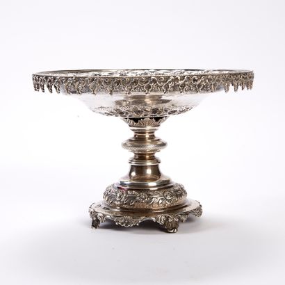null An 800-thousandth chased and repoussé silver display stand, the top decorated...
