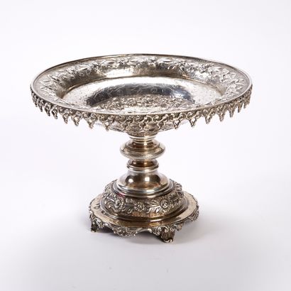 null An 800-thousandth chased and repoussé silver display stand, the top decorated...