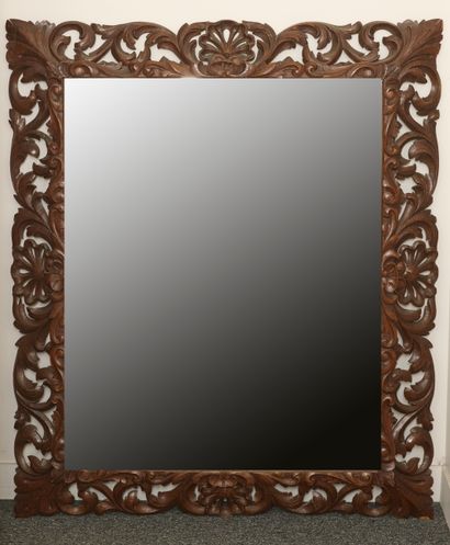 null Large rectangular mirror in carved, stripped and stained oak, the uprights with...