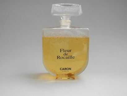 null CARON, "Fleur de Rocaille", flacon publicitaire décoratif en verre incolore...