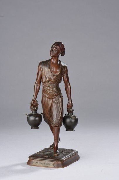 MARCEL DEBUT (1865 - 1933) Le Porteur d'eau.
Bronze patiné brun et brun-rouge signé...