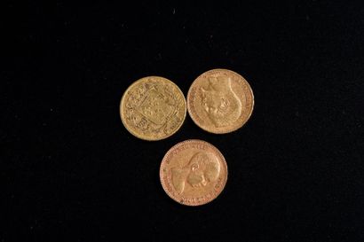 Trois pièces en or jaune: une de vingt francs...