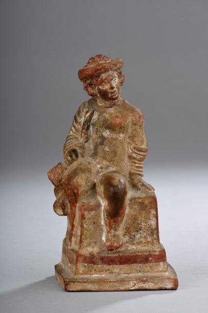 Statuette représentant un jeune garçon nu,...