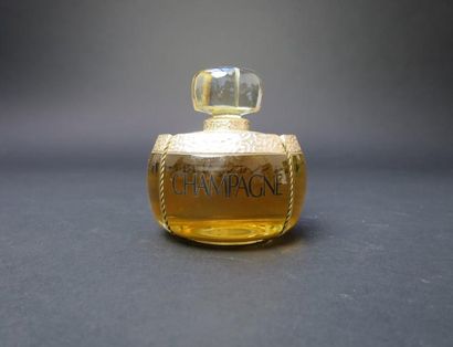 null Yves SAINT LAURENT "Champagne" (année 1993)
Flacon "bouchon de champagne" contenant...