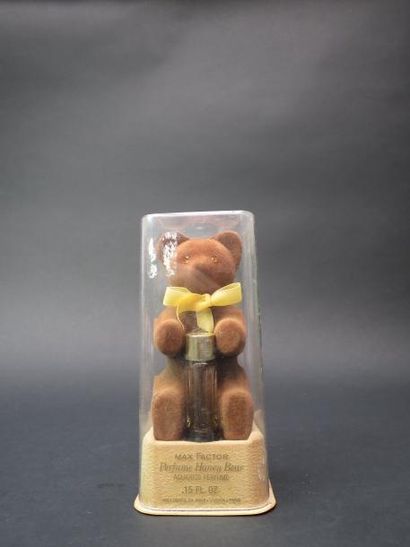 null Max FACTOR "Parfum Honey Bear"
Petit flacon présenté avec un ours en résine...