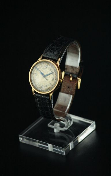 null Montre bracelet d'homme, le boîtier rond en or jaune 18k, le cadran argenté...