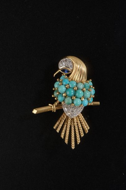 null Broche en or jaune 18k et platine représentant un oiseau de dos posé sur une...