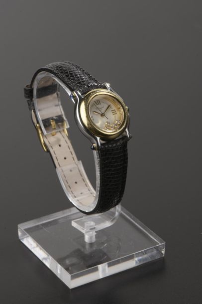 null CHOPARD
Montre bracelet de dame modèle "Happy Sport" en acier et métal doré,...