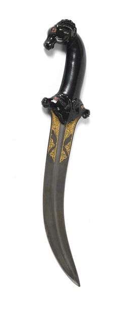 null Jambiya dagger, black jade handle with carved decoration of three goat heads,...