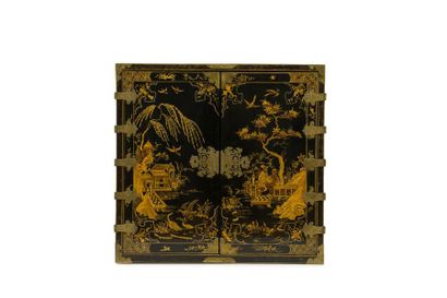 Lacquer cabinet with gold decoration on a...
