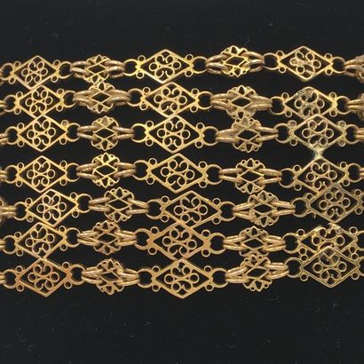 null "Cuff" bracelet in yellow gold (750 thousandths) made up of seven openwork chains....