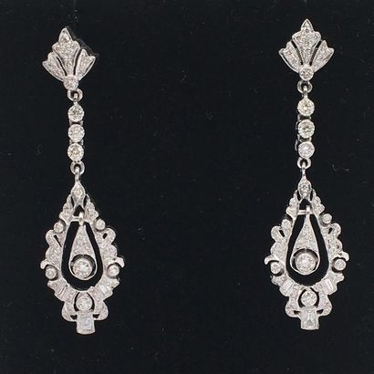 null Pair of "lace" earrings in openwork white gold (750 thousandths), set with brilliant-cut...