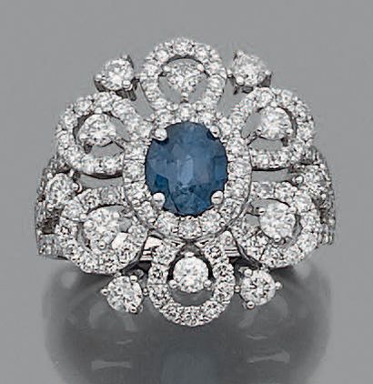 null Flower" ring in openwork white gold (750 thousandths), set with an oval sapphire,...
