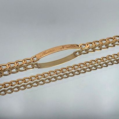 null Two yellow gold (750 thousandths) BRACELETS "bracelets", one centred on a plate...