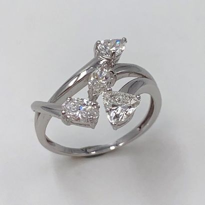null Design" ring in openwork white gold (750) set with four diamonds, two shuttle-cut,...