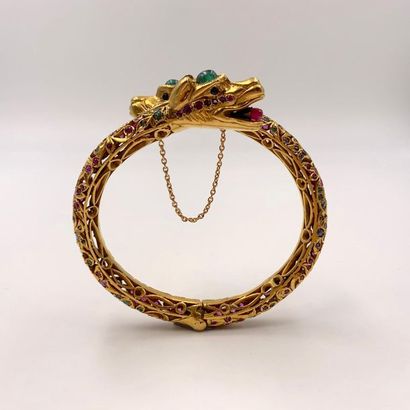 null Rigid "two snakes" BRACELET, opening in openwork yellow gold (750), chased and...