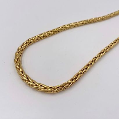 null NECKLACE in yellow gold (750) with a slightly falling "palm tree" mesh. Shocks....
