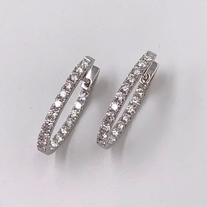 null Pair of EARRINGS "petites créoles" in white gold (750) set with an alignment...