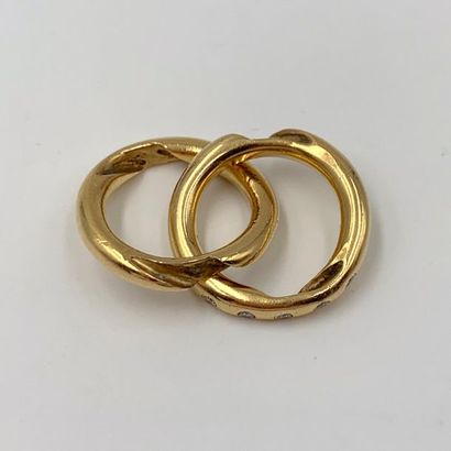 null DAMAS
BAGUE « deux joncs croisés imbriqués » en or jaune (750) dont un serti...