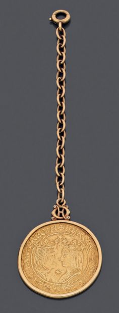 Part of a yellow gold (750‰) CHAIN holding...
