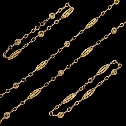 null Yellow gold jewelry (750‰) including a long
NECKLACE, a choker necklace, and...
