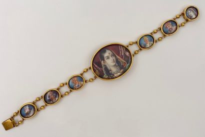 null Gilded metal BRACELET, composed of painted oval Indian miniatures representing...