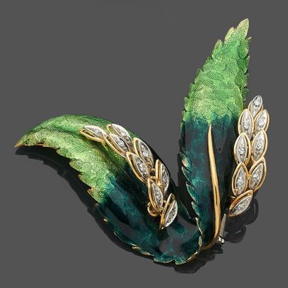null Yellow and white gold (750‰) chased "foliage" brooch, set with two-tone green...