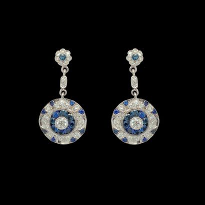 DIAFINI Pair of EARRINGS in white gold (750 thousandths) holding a circular motif...
